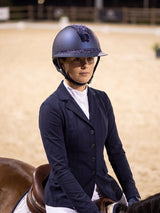Rider wearing a navy Samshield Miss Shield 2.0 Cosmic Night helmet riding in the arena