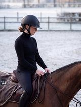 Rider wearing a Samshield Miss Shield 2.0 Glossy Glacier Top helmet riding on a frosty winter morning (AI)