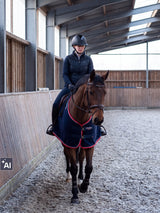 Rider wearing a Samshield Miss Shield 2.0 Glossy Glacier Top helmet riding in an exercise rug in the arena (AI)