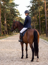 Rider wearing a Samshield Miss Shield 2.0 Shadowmatt Night Shade helmet on a hack along a forest track